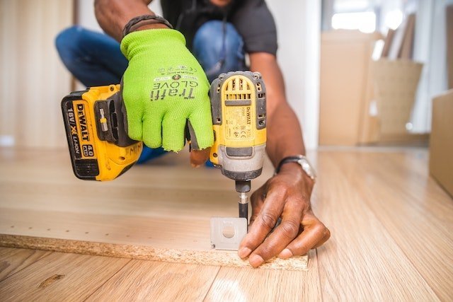 person fixing the floor