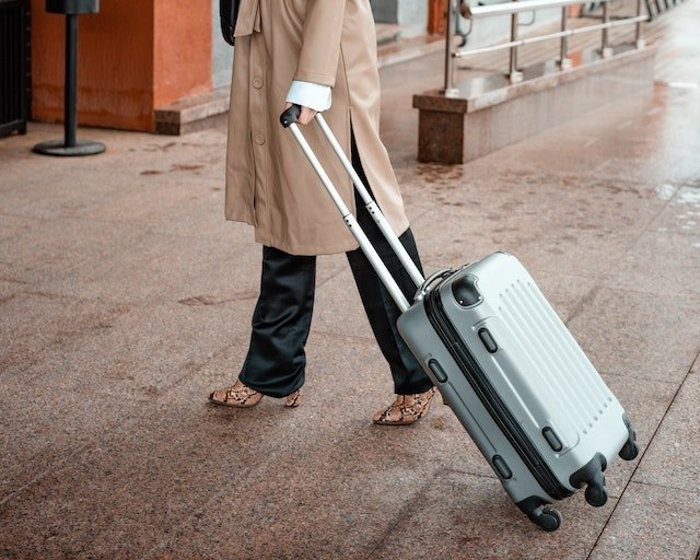 woman carrying a suitcase