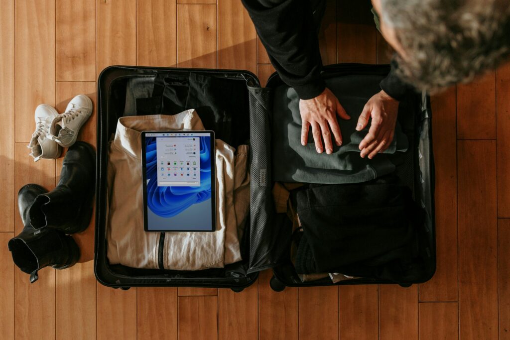 Traveller packing for a trip after asking can you book Airbnb for someone else.